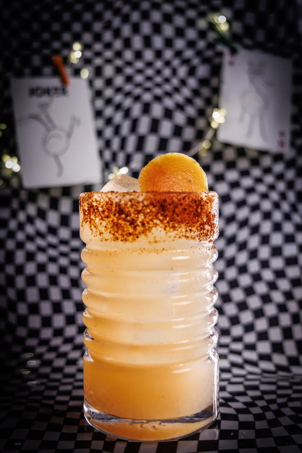 Burner Phone in a ribbed glass with a chili salt rim