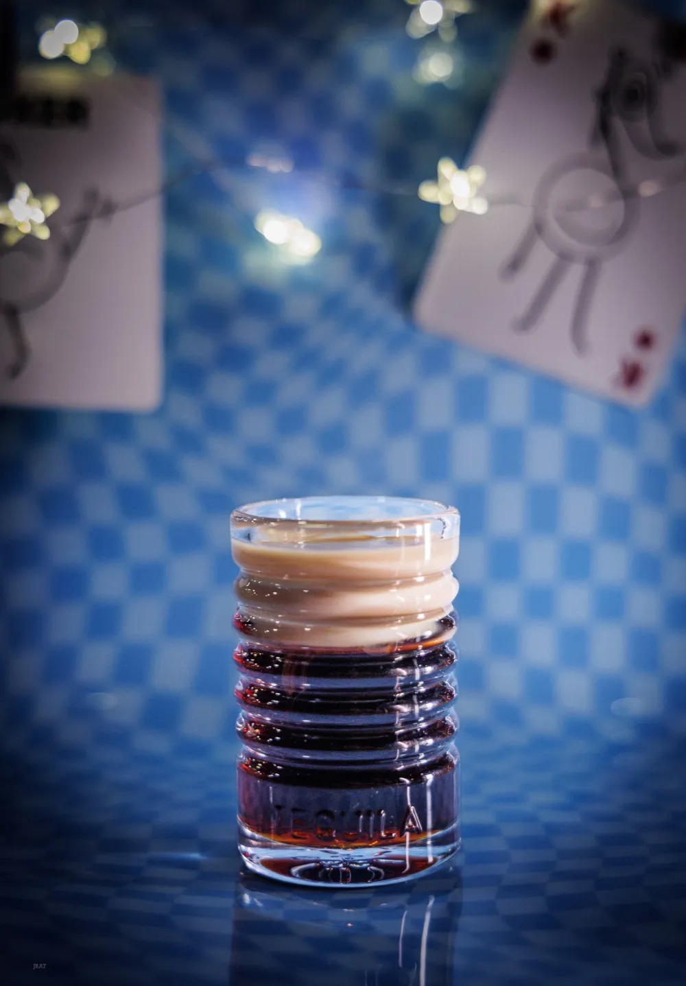 Baby Guinness shot, dark with a cream top