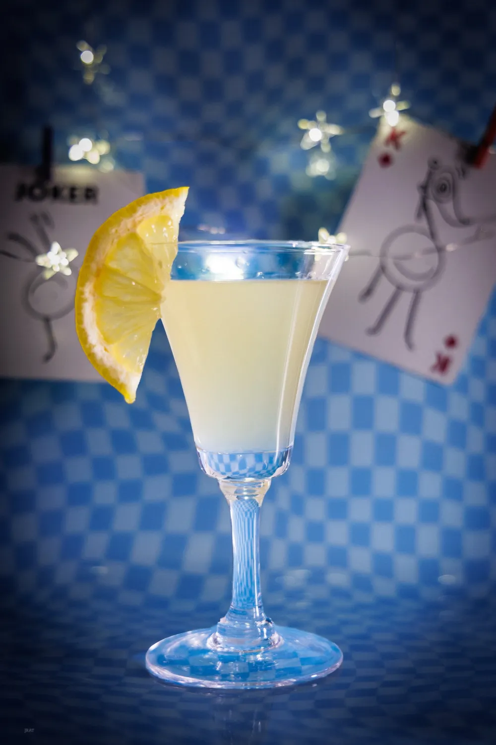 Limoncino shot with a lemon wheel